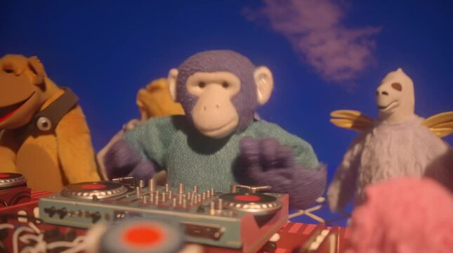Funny monkey puppet dj playing music at a party with friends