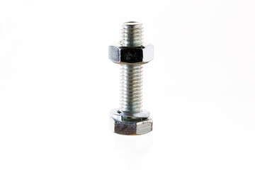 A close-up of a metallic bolt with a threaded shaft and two hexagonal nuts on either end. The...