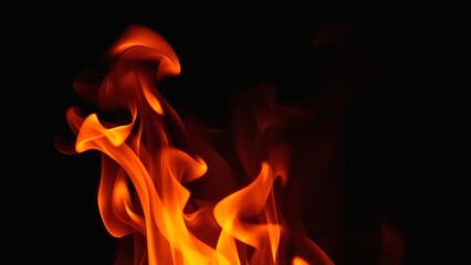 Fototapeta premium Fiery Inferno Abstract Art Photography of Dynamic Orange and Yellow Flames Against a Pitch Black Background