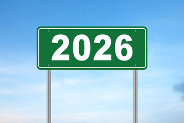 Green road sign arrow direction to new year 2026 on blue sky, concept. New year and new road to successful life, creative idea. Beginning 2026