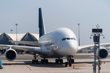 Giant passenger jet parked at a hub airport is about to depart for a flight