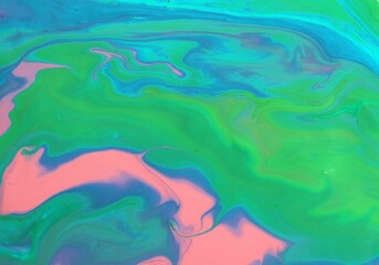 Pale pink and light malachite abstract background. The colors mix and create a unique pattern