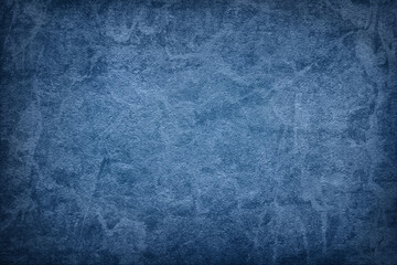 Texture of blue polished concrete background. Dark plaster wallpaper with rough cement texture. Empty grunge wall concept or floor backdrop. Abstract surface mockup. Top view, close up, copy space