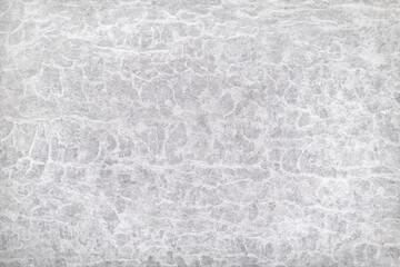 Texture of gray polished concrete background. Light plaster wallpaper with rough cement texture. Empty grunge wall concept or floor backdrop. Abstract surface mockup. Top view, close up, copy space