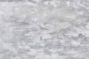 Fototapeta premium Texture of gray polished concrete background. Light plaster wallpaper with rough cement texture. Empty grunge wall concept or floor backdrop. Abstract surface mockup. Top view, close up, copy space