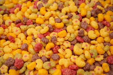 Sweet crunchy cornflakes as a background. Top view.