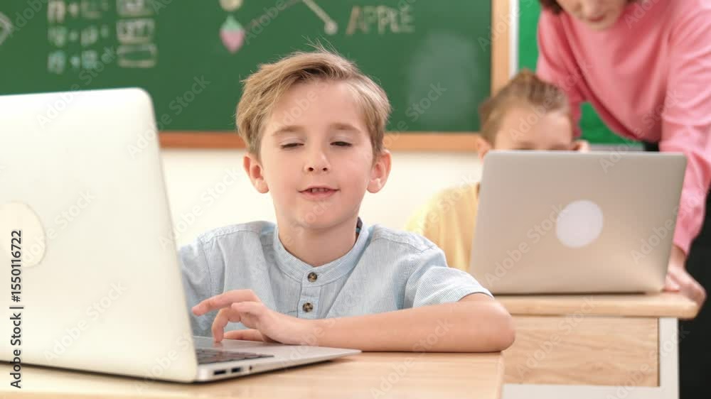 Poster caucasian boy working at laptop while diverse children programing software system. teacher and stude