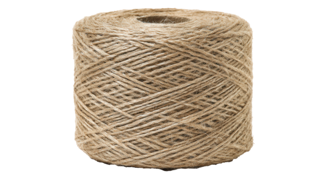Spool of natural jute string elegantly captured against a crisp white background, showcasing texture and detail in its rustic beauty