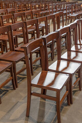 Close-Up of Rows of Wooden Pews Inside a Catholic Church