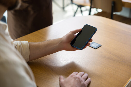 Person scanning QR code for menu at restaurant