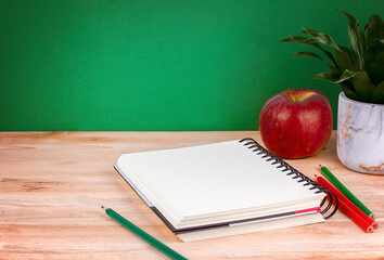 Back to school background with, Notebook, school supplies and apple 
