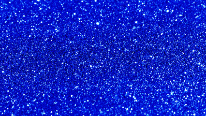 Blue glitter light shining sparkle texture background. Christmas New Year and Celebration background concept.