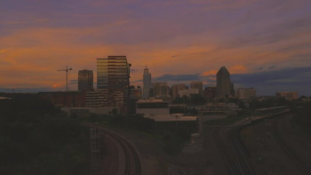 A nice timelapse video of the city of Raleigh, North Carolina by the train station from day to night in toned colors.
