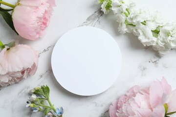 Romantic flat lay with paper card, peonies, flowers, on marble. Ideal for wedding invitations, event announcements, or feminine branding