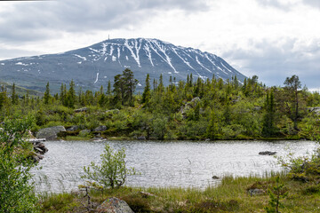 Overcast Landscape of Gaustatoppen and Mountain Lake