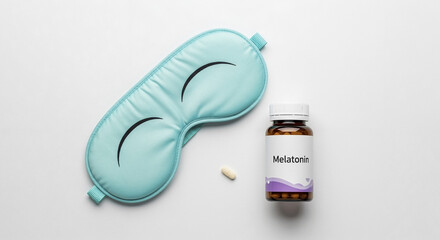 Sleep mask near melatonin bottle and tablet on white background  
