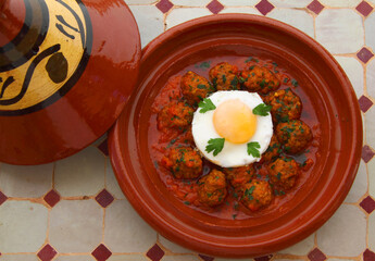 Morocco. Tajine of Kafta - Typical Moroccan and Lebanese dish of meatballs in a tomato sauce with...