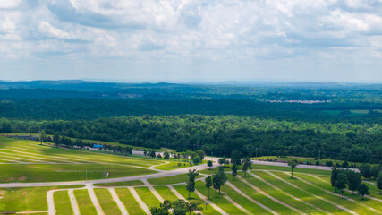 aerial shot of vast miles of lush green trees and homes at the Nashville Superspeedway in Lebanon...
