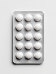 White pills in blister pack on clean background
