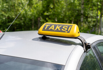 Turkish taxi.The inscription taxi on the car.He worked as a chauffeur.Pick up a passenger from the airport.