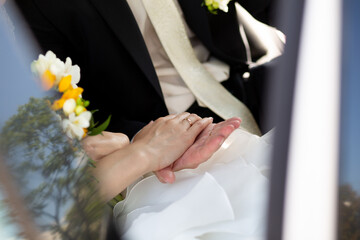 Bride and Groom Holding Hands on Wedding Day