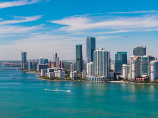 Naklejka premium Skyscraper building. Cityscape building downtown. City architecture. Miami skyline. Florida skyscraper cityscape. Miami city skyline view of Brickell key. Miami downtown. Brickell Miami