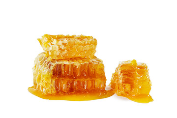 Honeycombs with flowing honey isolated on white background.