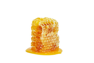 Honeycombs with flowing honey isolated on white background.