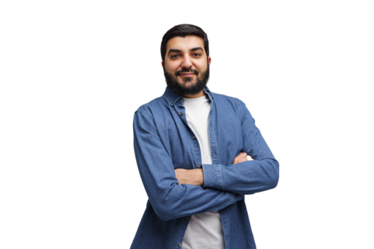 Confident gaze from a bearded Middle Eastern man in denim, with arms crossed, standing proud on a white canvas