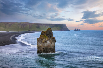 Impressive view of Kirkjufjara black sand beach from Dyrholaey promontory on Atlantic South Coast.