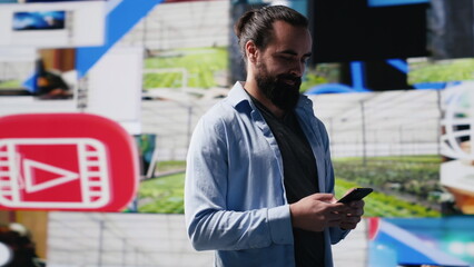 Modern online lifestyle of a young man checking real time notifications, enjoying interaction with...