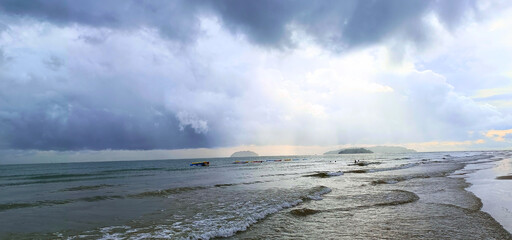 Tanjung Aru View from Serene Sandy Shore Under Overcast Skies