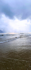 Tanjung Aru View from Serene Sandy Shore Under Overcast Skies
