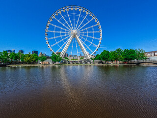 Fototapeta premium ferris wheel Architecture in old Montreal, Quebec, Canada