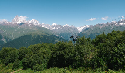 Mountain landscape with cable car gondola, scenic alpine view, hiking tourism, eco travel destination, snow peaks.