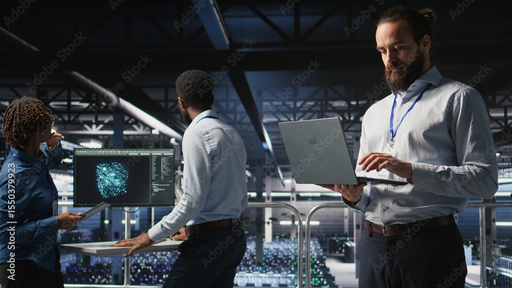 Poster computer scientists on data center industrial platform analyzing performance outputs on laptop. serv