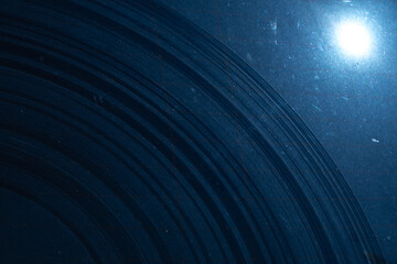 Abstract dark blue circular pattern resembling space rings, cosmic background or vinyl record....