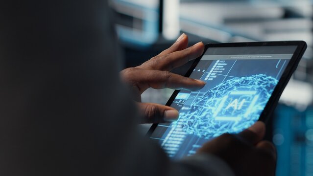 Data center computer scientist coding on laptop, doing software updates. African american server hub IT expert using notebook device, optimizing infrastructure rackmounts configuration rigs, camera B