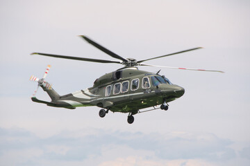 flying military transport helicopter in the sky