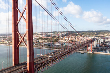 Aerial view of cars crossing the 25 de abril bridge in Lisbon, Portugal.