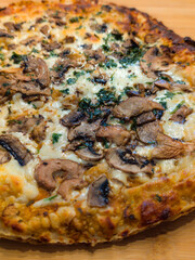 tasty italian pizza with mushrooms and herbs