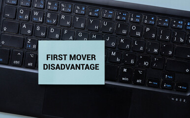 text First Mover Disadvantage on torn paper.