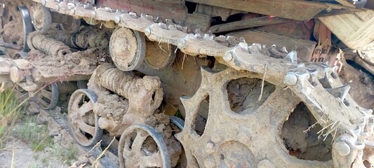 DT Tracked Tractor Navigating Through Muddy Terrain During Springtime Agricultural Activities