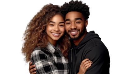 Smiling young diverse couple embracing in casual clothing with curly hair and joyful expressions on a solid dark background