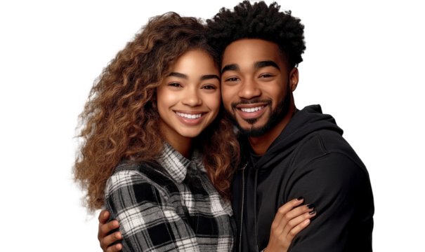Smiling young diverse couple embracing in casual clothing with curly hair and joyful expressions on a solid dark background