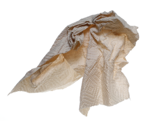 Natural brown paper kitchen towels flying, disposable, non-toxic and no dyes, crumpled and wrinkled ball isolated on white background