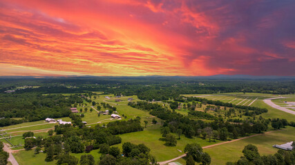 aerial shot of vast miles of lush green trees and homes at the Nashville Superspeedway in Lebanon...