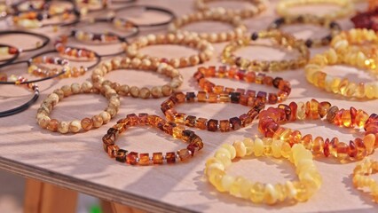 Valuable Jewelry Natural Amber Bracelet Sold on Outdoor Market Stand at Baltic Sea Resort in Poland