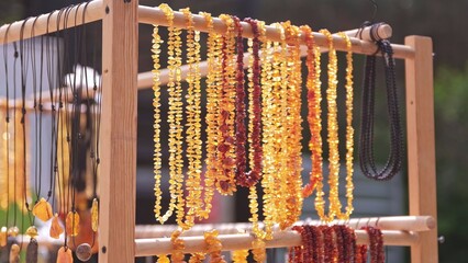 Valuable Jewellery Natural Amber Necklaces Sold on Outdoor Market Stand at Baltic Seaside Resort in Poland