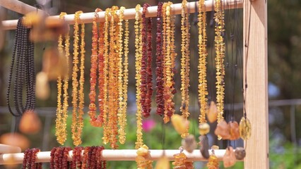Valuable Jewellery Natural Amber Necklaces Sold on Outdoor Market Stand at Baltic Seaside Resort in Poland